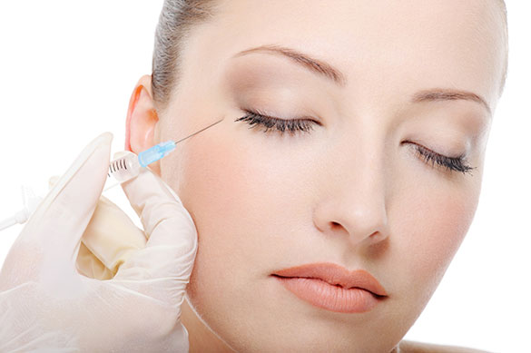 Woman receiving Botox near eyes