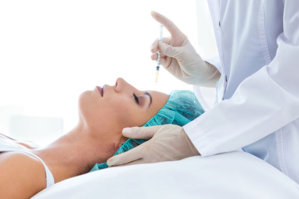 Woman receiving Botox on forehead