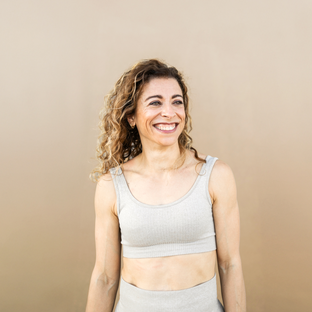 women wearing grey athletic wear on a beige background