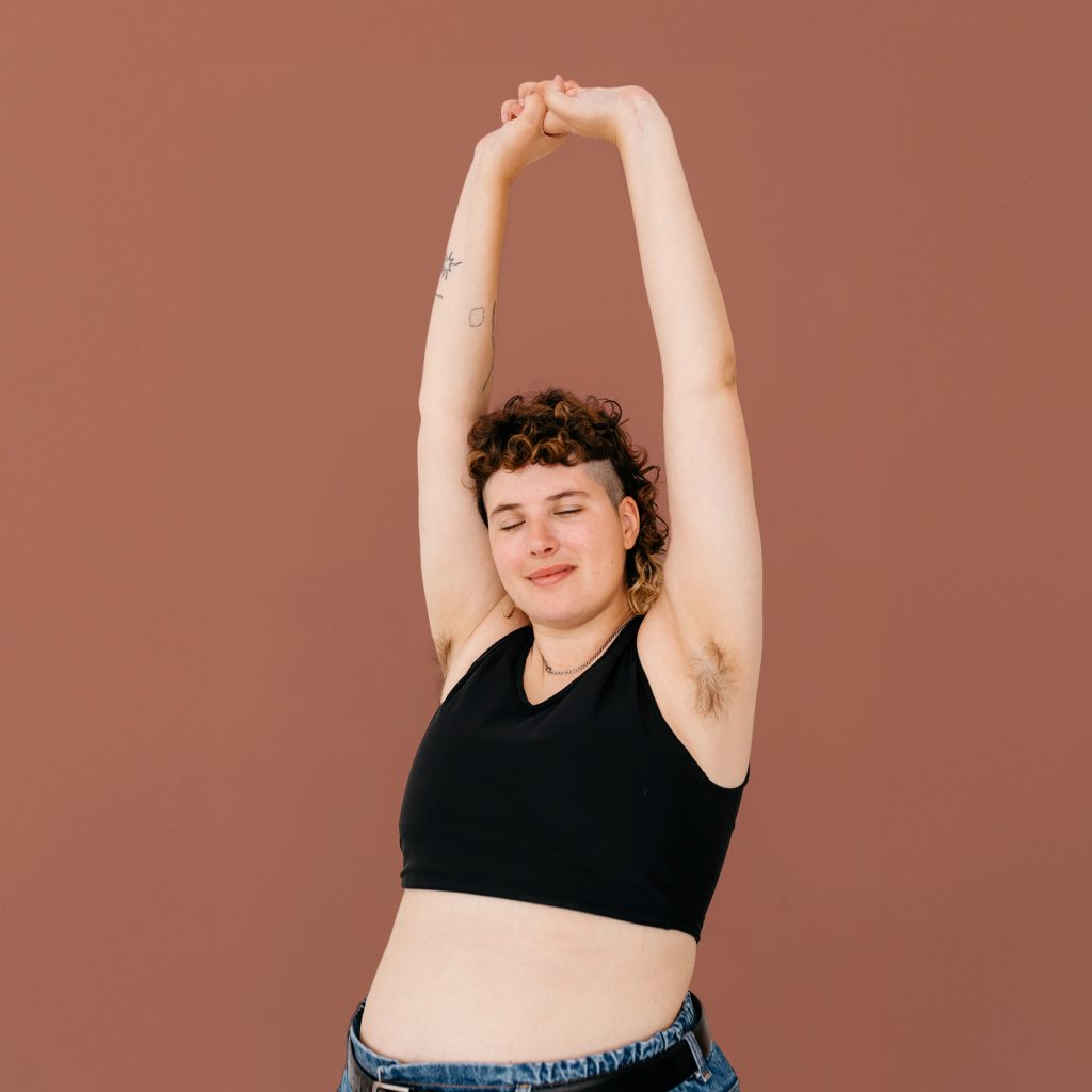 picture of person with the arms above head on brown background