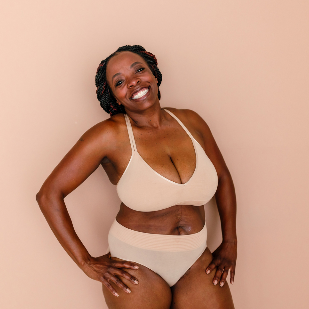 picture of curvy dark skinned women in beige under garments.