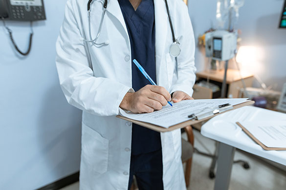 Below the head shot of a doctor wearing a white robe with a clipboard and marking something on the paper