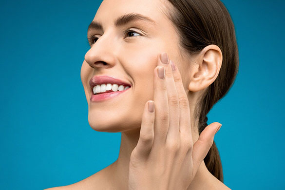 Woman touching cheeks and smiling