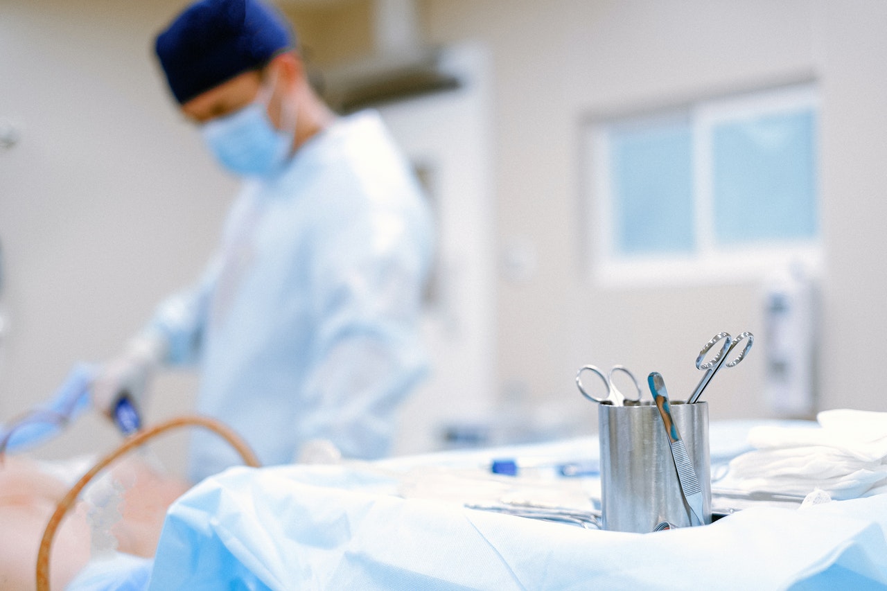 doctor ensuring liposuction safety